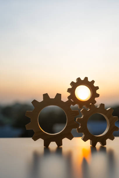 istock Gears from at blue urban and sunlight background. concept of a teamwork cooperation idea. 2188156310