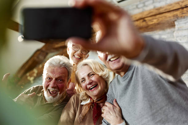 istock Happy seniors taking a selfie with cell phone at home. 2188156830