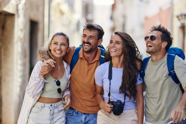 istock Cheerful tourists having fun while walking on the street. 2188157700