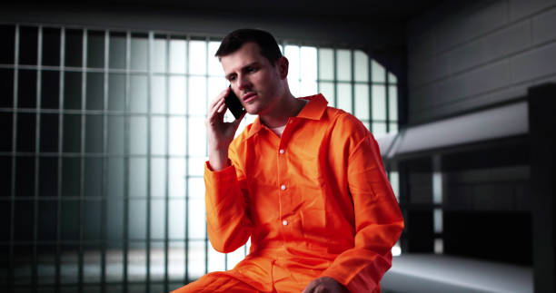 Prisoner Behind Bars In Jail Cell. Crime Punishment And Criminal Justice