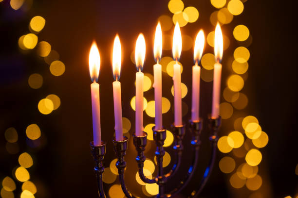 istock Hanukkah Menorah with Candles on Dark Background 2188159107