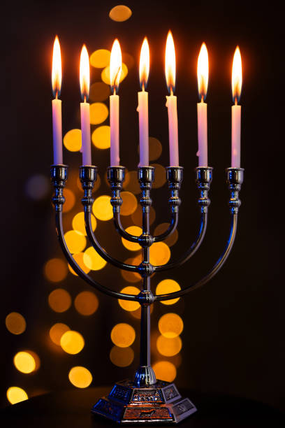 istock Hanukkah Menorah with Candles on Dark Background 2188159124