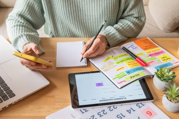 istock Professional Woman At Home Or Office Organizing Her Digital Planner, Setting Appointments, Checking Emails, Planning Budgets, Tracking Expenses, Paying Bills, And Achieving Time Management Goals 2188159891