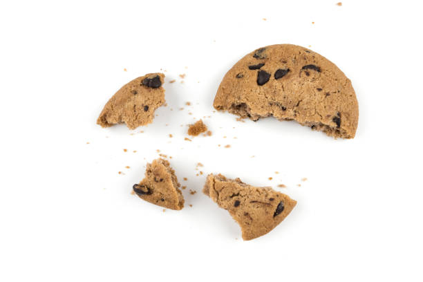 istock Top view of a singular biscuit chocolate cookie bite with crumbs, isolated on white background 2188161084