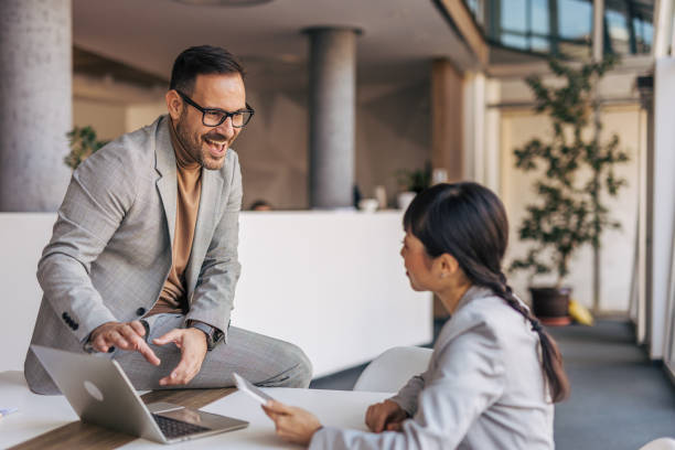 istock Coworkers having a meeting in a conference room 2188162340