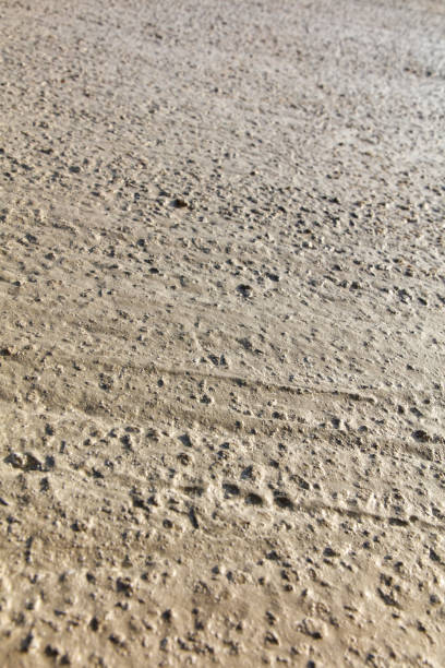 istock A close up of a sandy surface with many small rocks scattered throughout 2188162663
