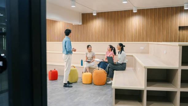 istock Team brainstorming session in a contemporary office, showcasing casual collaboration, creativity, and productivity among young multicultural professionals. 2188163062