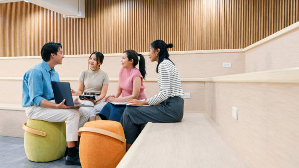 istock A creative team collaborates in a casual modern workspace, engaging in focused discussions and project planning. Ideal for workplace culture and productivity visuals. 2188163096
