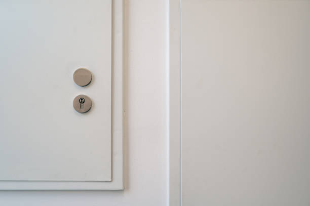 istock Partial view of a white door with lock 2188165206