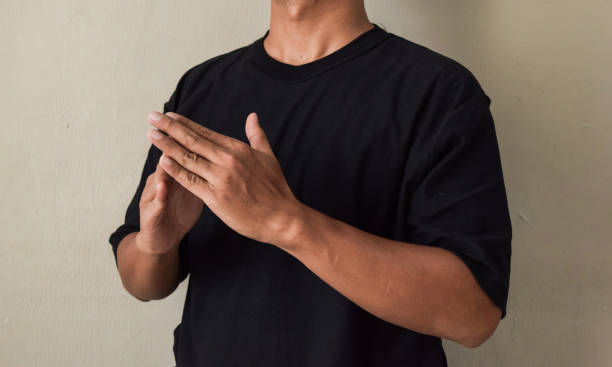 istock Sign Language man interpreter gesturing in sign language on gray background 2188167996