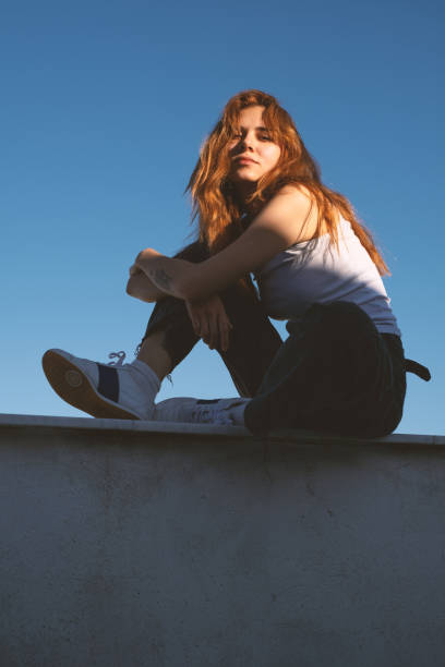 istock Attractive Young Redhead Woman on a Rooftop 2188168016
