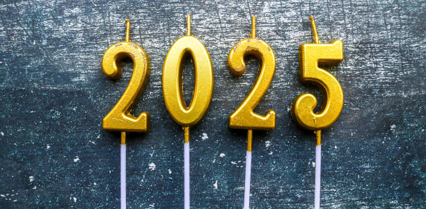 istock candles in shape of 2025 year with grey background 2188169784