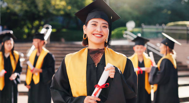 istock Woman, university student and happy with certificate for graduation, celebration and achievements in Japan. Female person, college graduate and proud on portrait with scroll for academic success 2188173798
