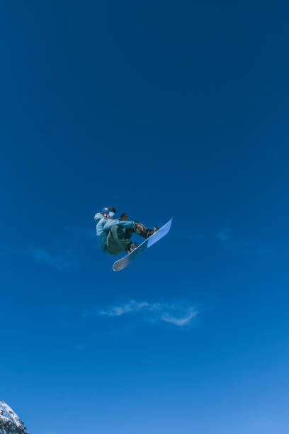 Snowboarder gets air off of jump