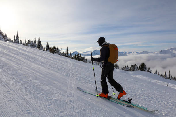 istock Ski mountaineer ascends ski track at resort 2188176607