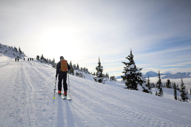 istock Ski mountaineer ascends ski track at resort 2188176609