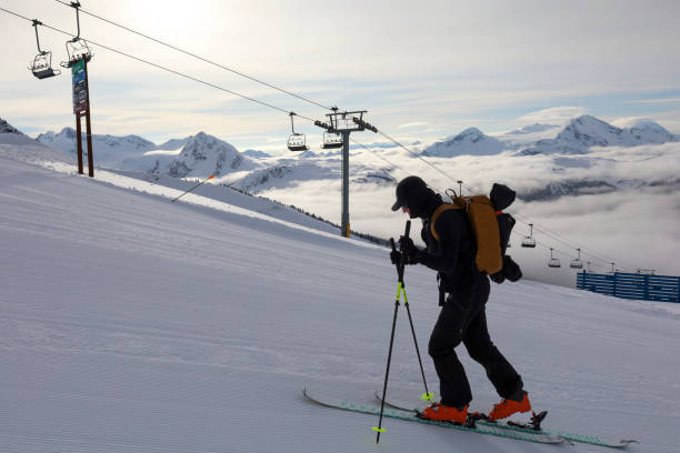 istock Ski mountaineer ascends ski track at resort 2188176625