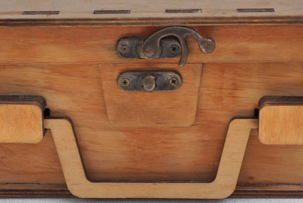 istock one small black brass latch with a pattern on the brown wooden board 2188180117