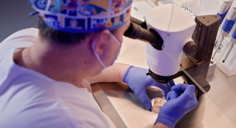 Embryologist Performing In Vitro Fertilization Procedure in Laboratory