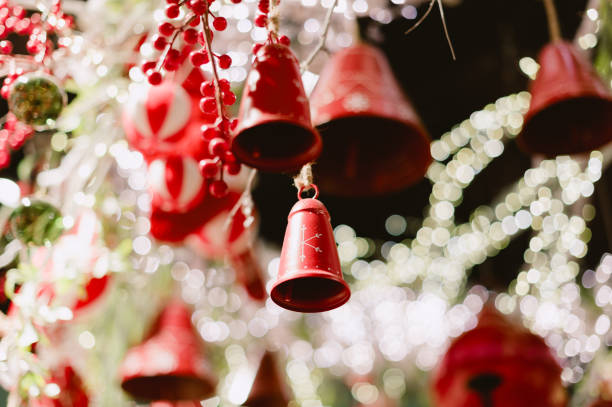 istock A bunch of red bells hanging from a tree. Christmas 2188180617