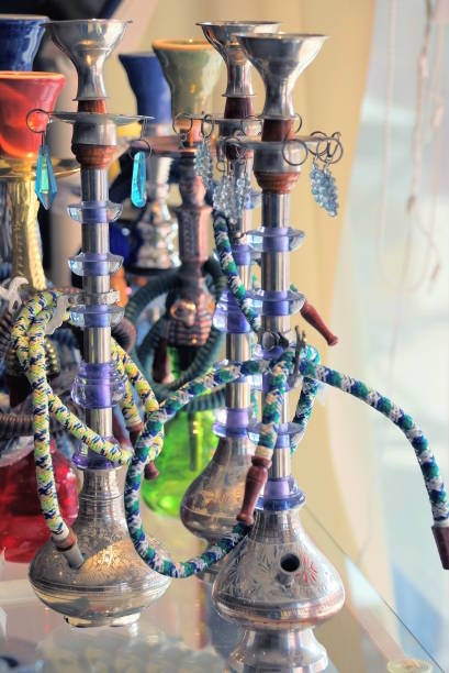 istock a row of colored hookahs stand on a glass table display case 2188180765