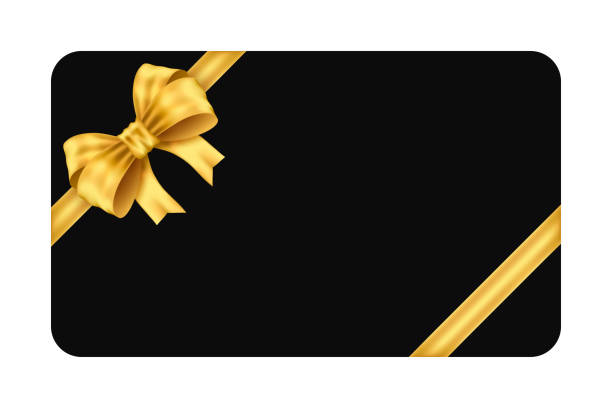 istock Mockup black gift card with two diagonal gold ribbon and gold bow isolated on white background 2188180891