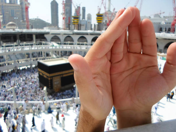 istock People praying at the holy kaaba, Mecca 2188181958