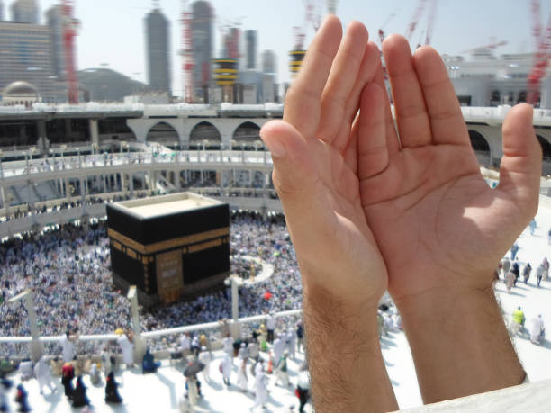istock People praying at the holy kaaba, Mecca 2188181959