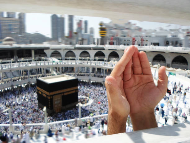 istock People praying at the holy kaaba, Mecca 2188181960