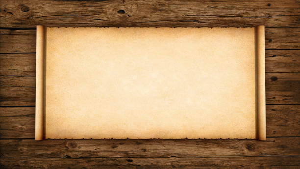 istock Antique parchment scroll with worn edges on a rustic wood background. 3D Rendering 2188182809