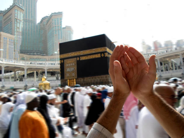 istock People praying at the holy kaaba, Mecca 2188183025