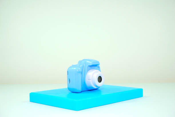 A toy camera displayed isolated on white background closeup view