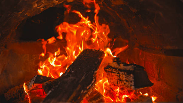 istock Fiery Blaze Engulfs Wood in Hearth 2188183478