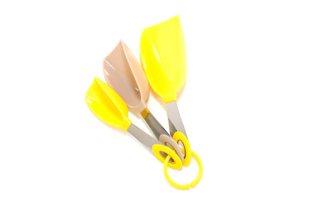 Plastic measuring scoops together isolated on white background close-up view group object