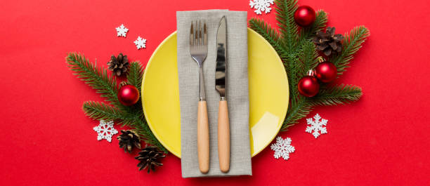 istock Christmas table place setting with christmas decor and plates, kine, fork and spoon. Christmas holiday background. Top view 2188189453