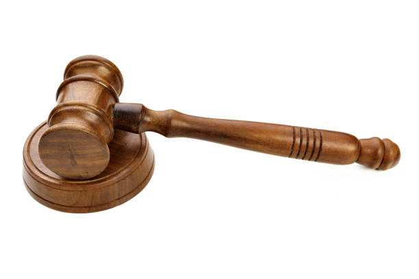 istock A wooden judge gavel isolated on white background 2188190246