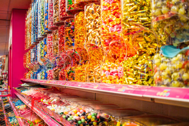 istock Vibrant Candy Display in a Shop with Colorful Sweets Arranged in Rows Highlighting the Variety and Abundance of Sugary Treats at a Candy Store for Sweet Lovers and Candy Enthusiasts 2188192704