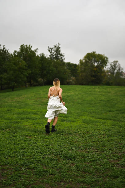 Running away on green lawn.
