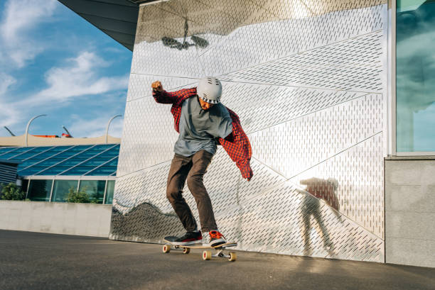istock Skateboarder balancing on board while performing trick in urban setting 2188198589