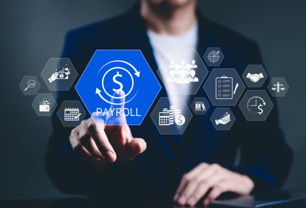 istock Payroll Management and Financial Processing System. Businessman works on payroll management with icons for payment, employee salaries, scheduling, analysis finance, and efficient payroll operations. 2188202565