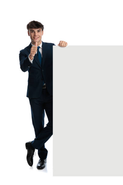 istock confident businessman with empty board making thumbs up gesture 2188203585