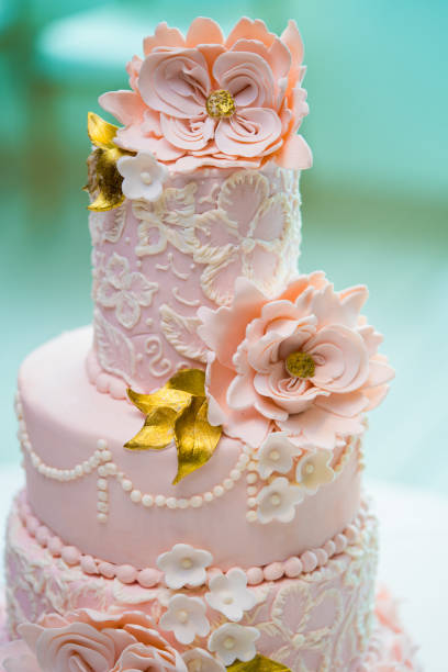 istock Stunning three-tiered wedding cake covered in elegant pink fondant 2188203776