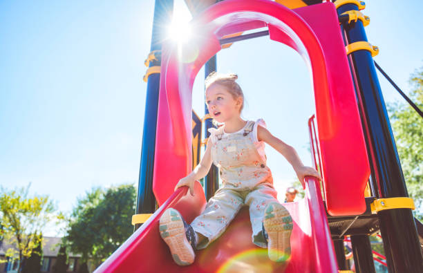 istock Happy kid slide on playground on summer season 2188204532
