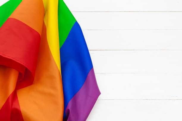 istock Gay pride flag on wooden table shot in studio 2188204847