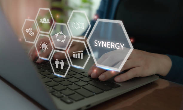 istock Business Synergy Concept. A business professional interacting with a virtual interface displaying icons of teamwork, growth, and innovation, highlighting the concept of synergy in corporate strategy. 2188206939