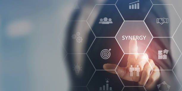 istock Business Synergy Concept. A business professional interacting with a virtual interface displaying icons of teamwork, growth, and innovation, highlighting the concept of synergy in corporate strategy. 2188206942