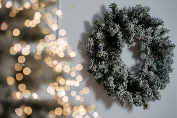 istock Frosted Christmas wreath with festive lights. 2188207481