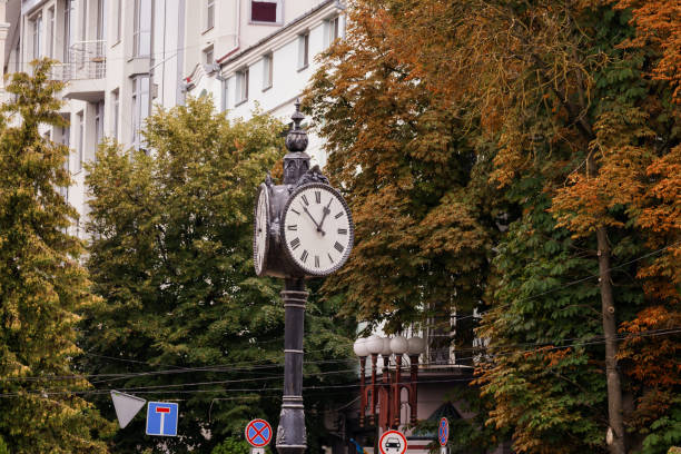 istock Vintage Clock Tower Amidst Autumn Foliage in Urban Setting 2188208546