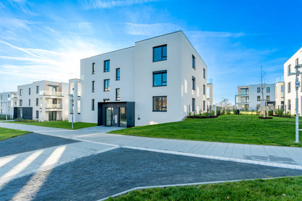 istock Modern residential complex with green areas and pathways on sunny day 2188209719