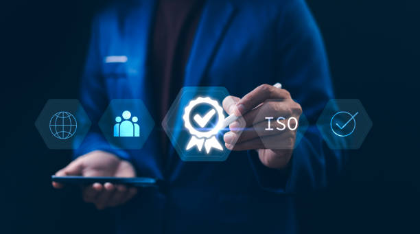 istock Quality control Businessman touch on ISO  sign or tick mark with document icon for approve quality assurance and guarantee concept, online approve paperless and quality assurance concept. 2188211553